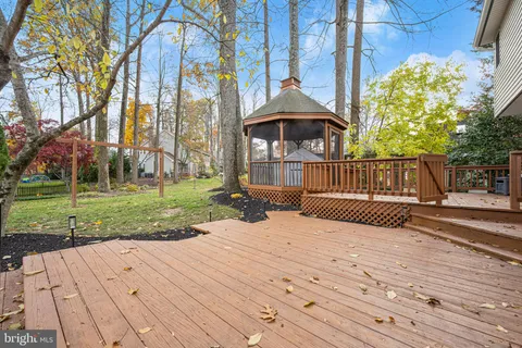 a view of outdoor space with garden and trees