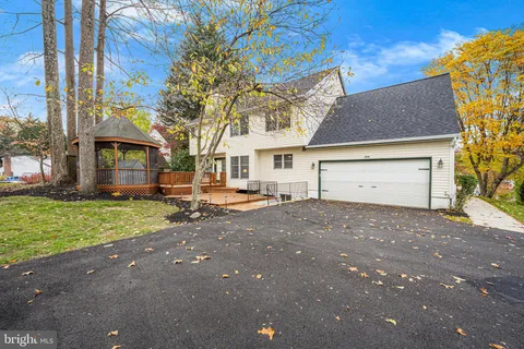 a view of a house with a yard and garage