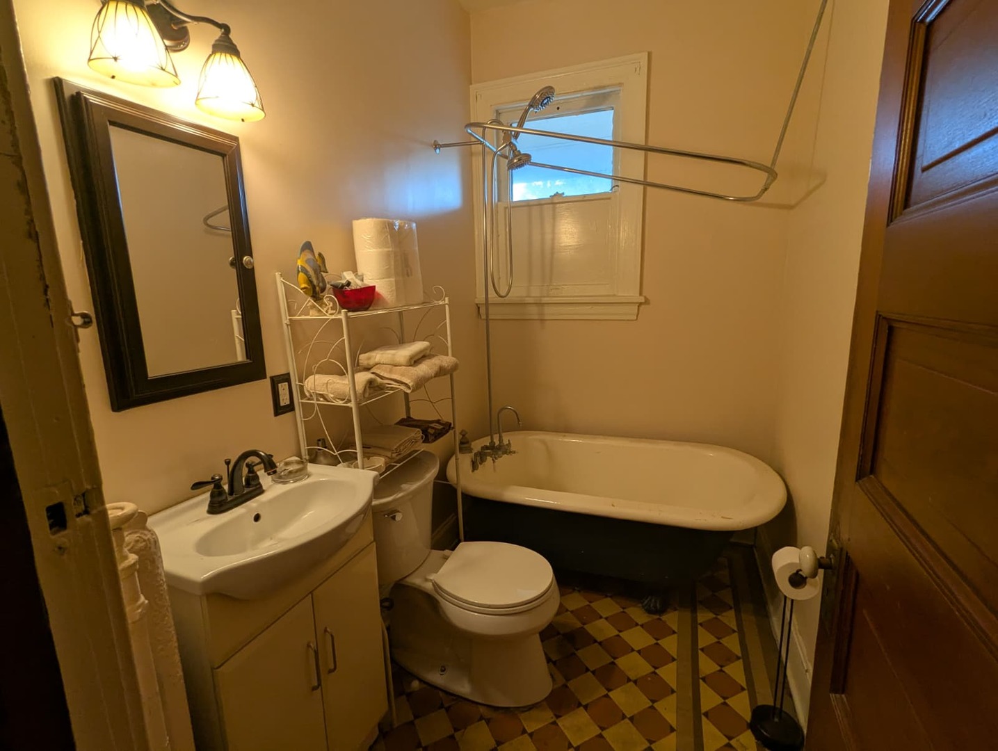 1635 20th Street Rock Island, IL 61201 - Photo 12 of 25 a bathroom with a sink a toilet and shower