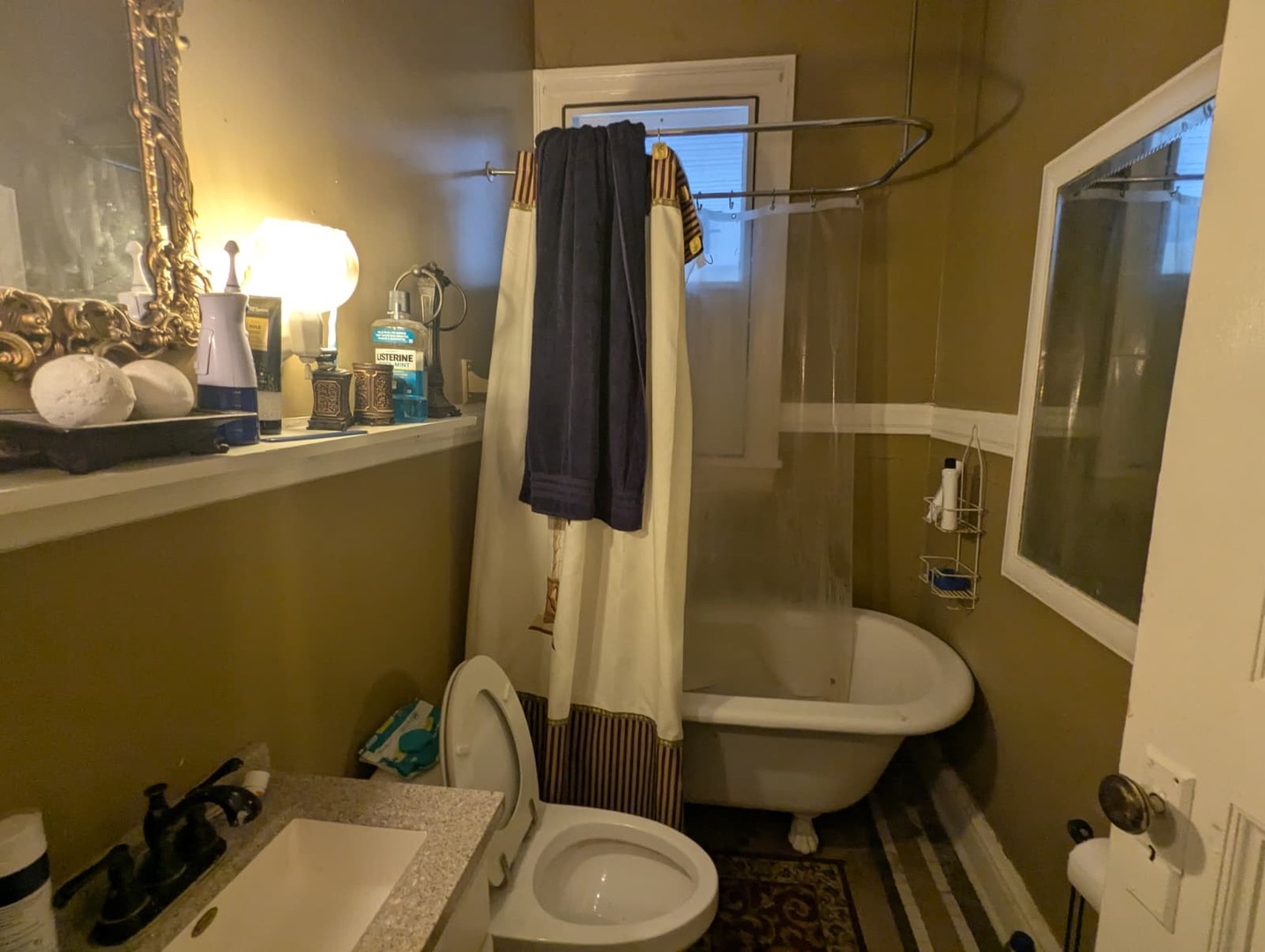 1635 20th Street Rock Island, IL 61201 - Photo 17 of 25 a bathroom with a sink toilet and shower