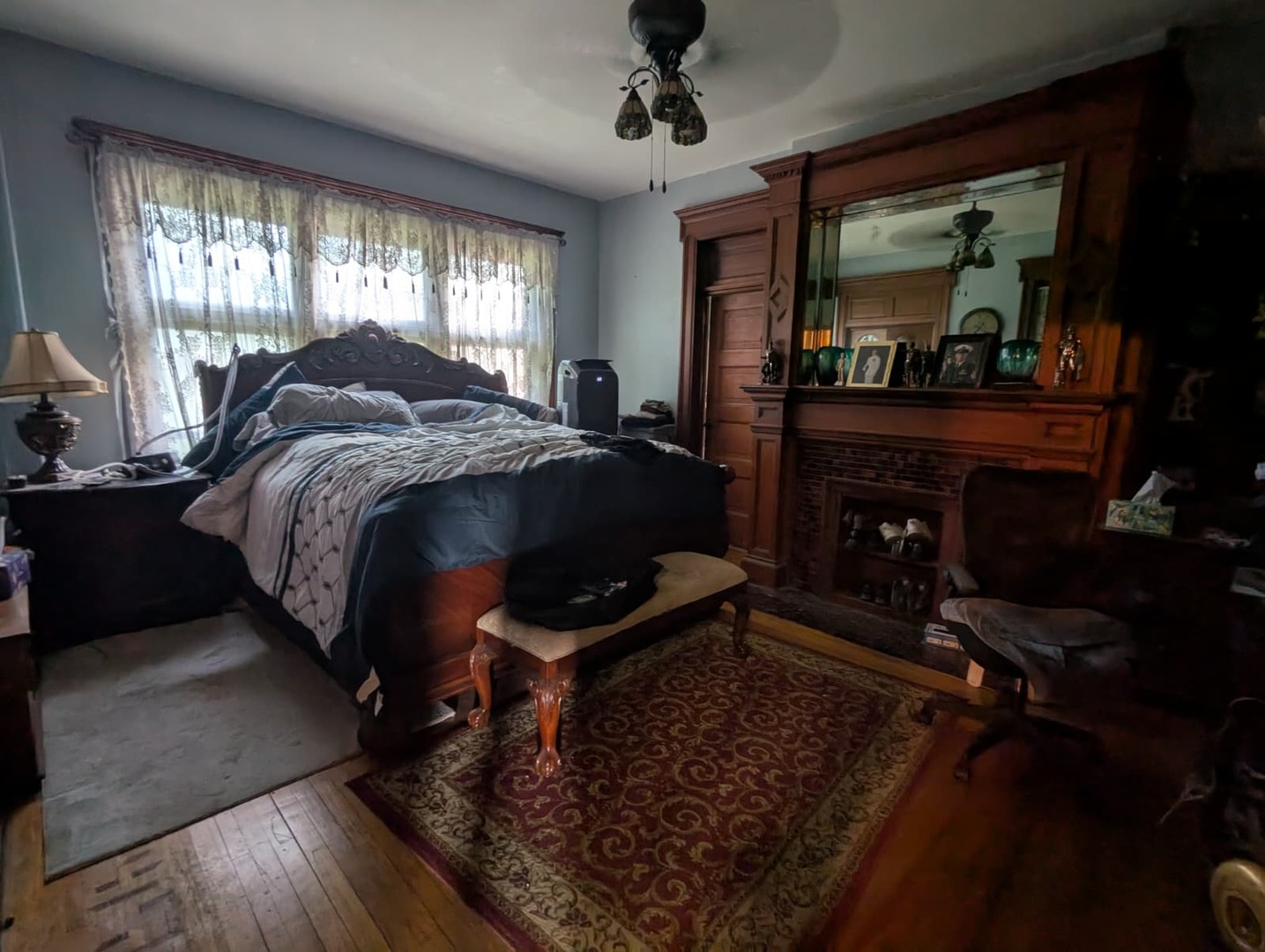 1635 20th Street Rock Island, IL 61201 - Photo 9 of 25 a spacious bedroom with a bed a dresser and mirror