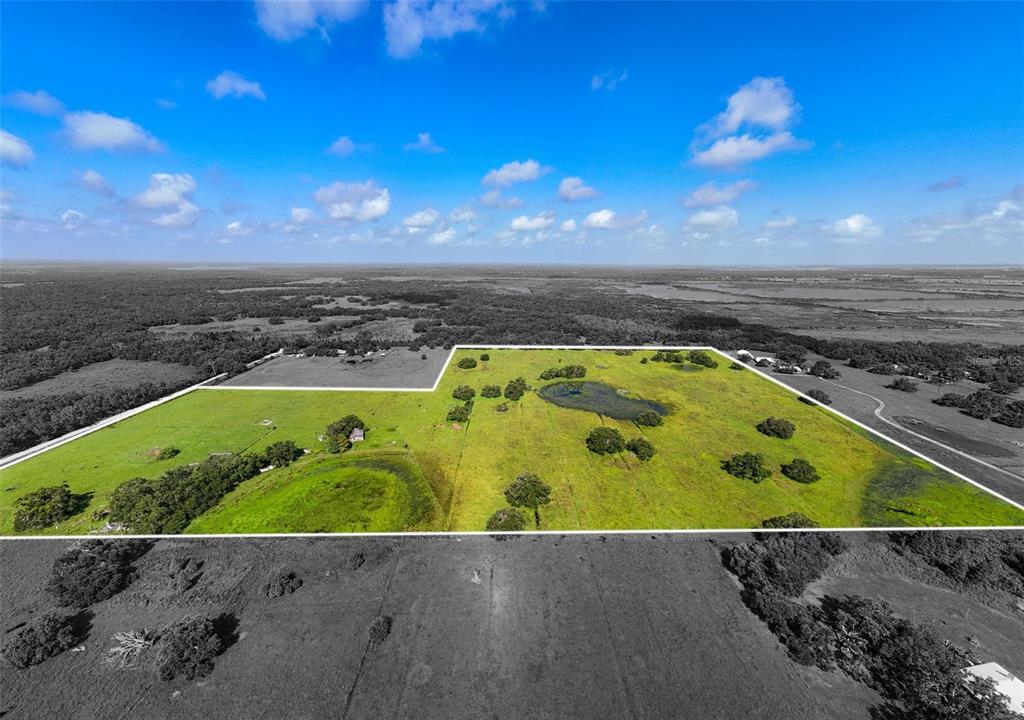 12950 River Road Myakka City, FL 34251 - Photo 24 of 32 an aerial view of a swimming pool