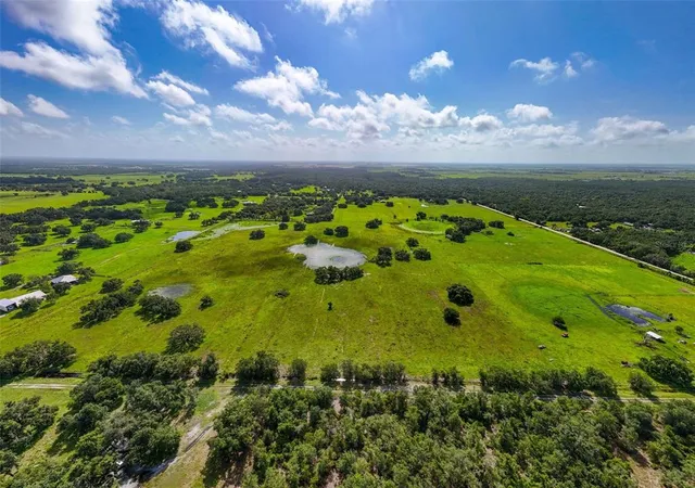 a view of a golf course with a lake