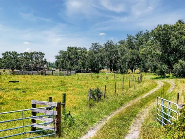 a view of a swimming pool with an outdoor space and seating area