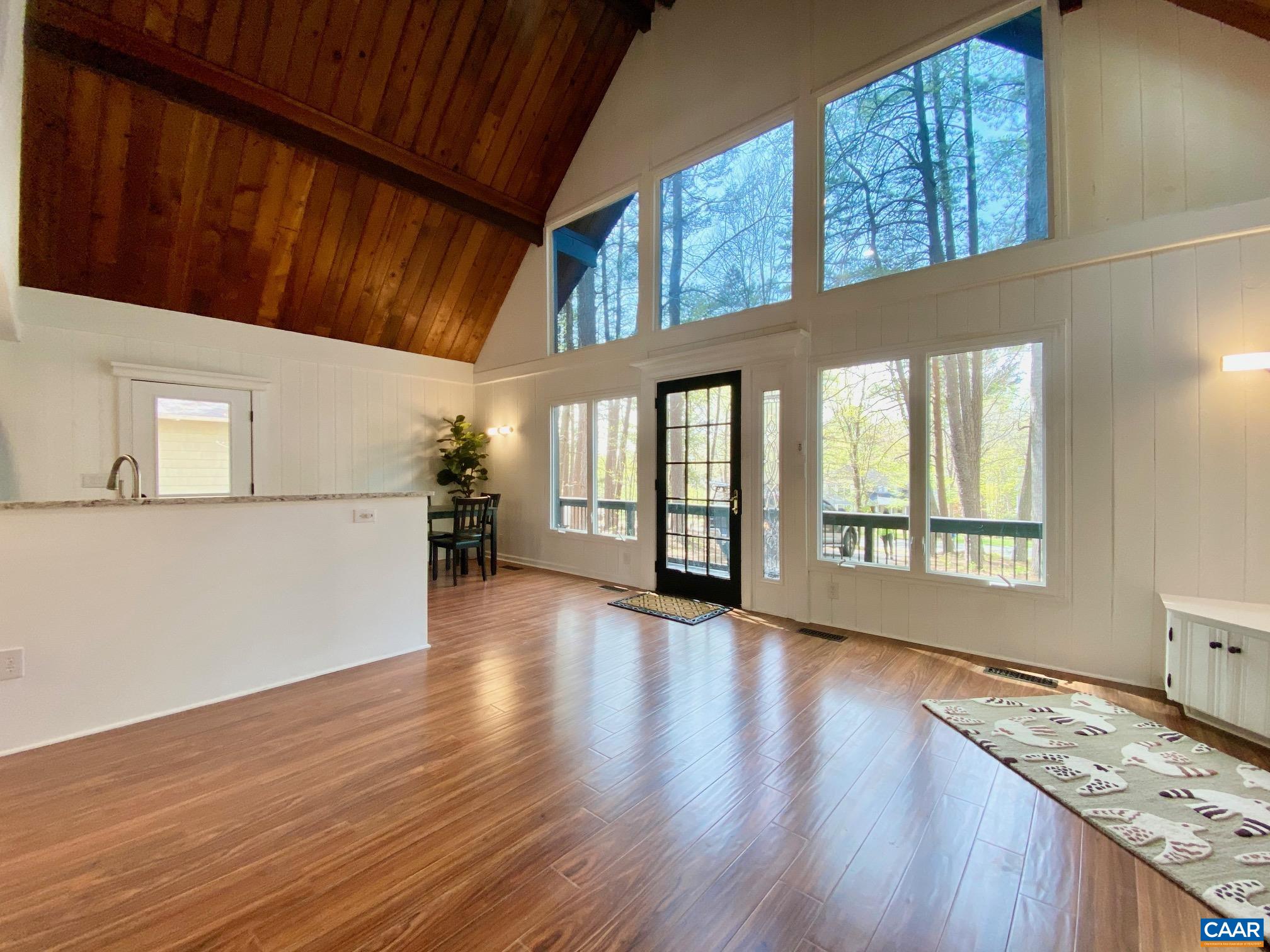 24 Tanglewood Road Palmyra, VA 22963 - Photo 6 of 23 a view of an empty room with wooden floor and a window