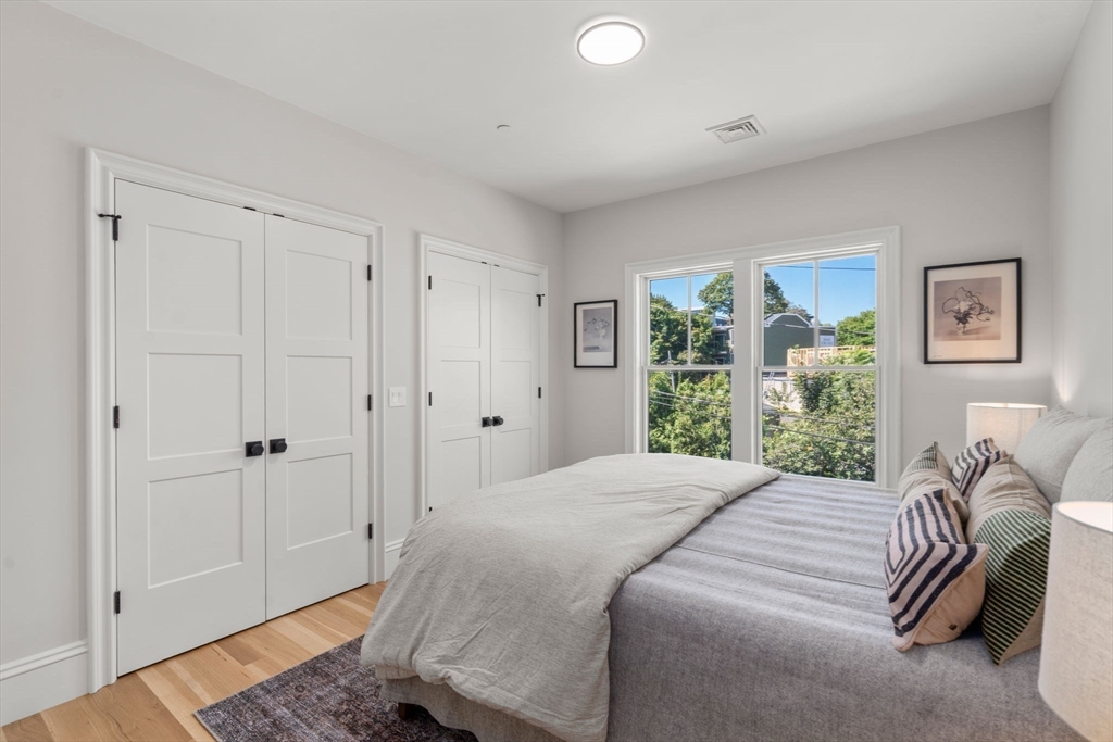 69 Williams Street, Unit 202 Boston, MA 02130 - Photo 13 of 22 a bedroom with a bed and a window