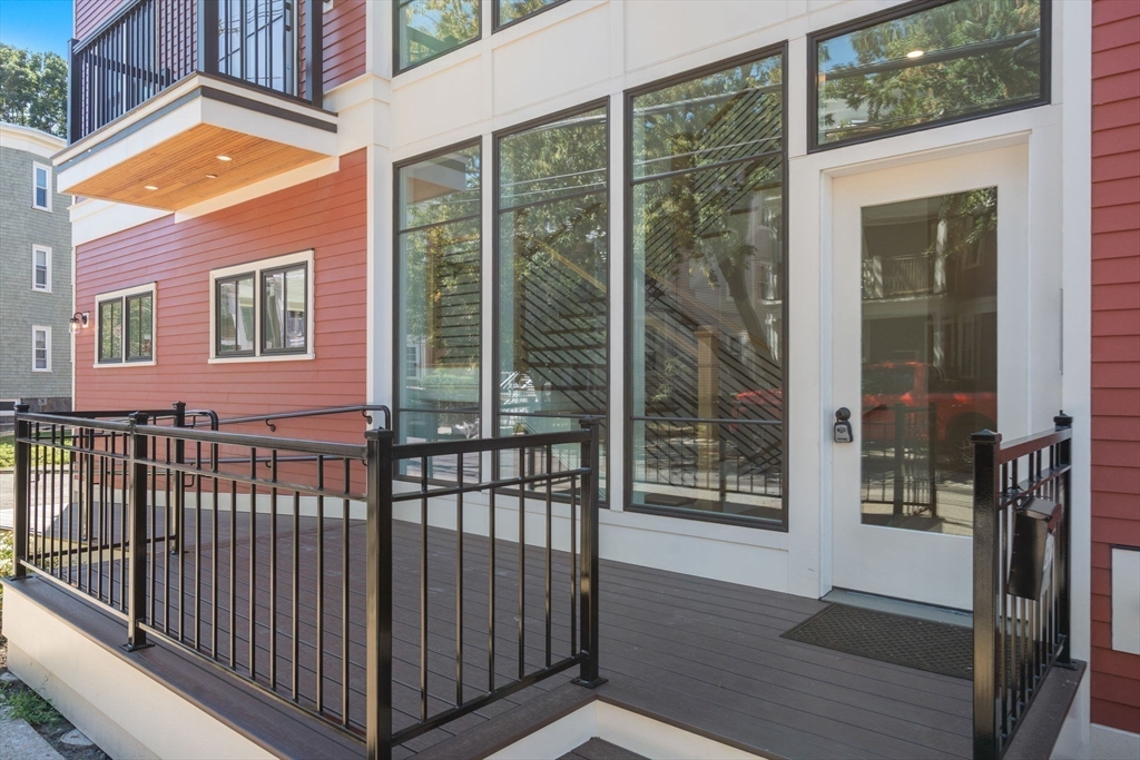 69 Williams Street, Unit 202 Boston, MA 02130 - Photo 22 of 22 a view of a brick house with a large window