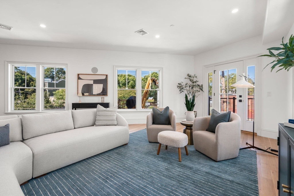 69 Williams Street, Unit 202 Boston, MA 02130 - Photo 3 of 22 a living room with furniture and a large window