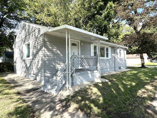 5174 Independence Avenue Portage, IN 46368 - Photo 1 of 26 a backyard of a house with table and chairs