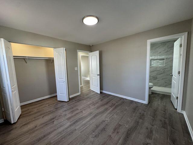 5174 Independence Avenue Portage, IN 46368 - Photo 11 of 26 an empty room with wooden floor and windows
