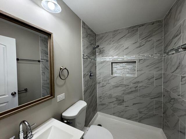 5174 Independence Avenue Portage, IN 46368 - Photo 12 of 26 a bathroom with a toilet and a shower