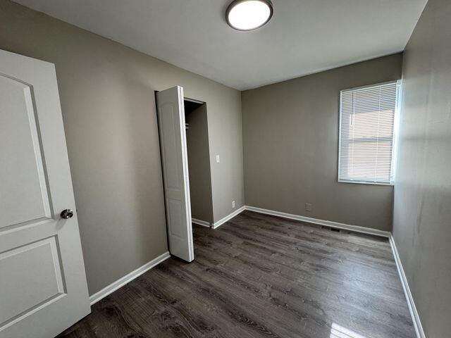 5174 Independence Avenue Portage, IN 46368 - Photo 14 of 26 an empty room with wooden floor and window
