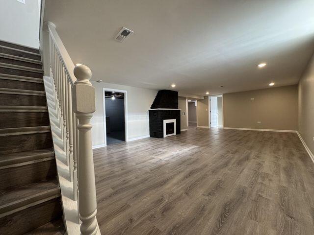 5174 Independence Avenue Portage, IN 46368 - Photo 16 of 26 a view of a livingroom with wooden floor and stairs