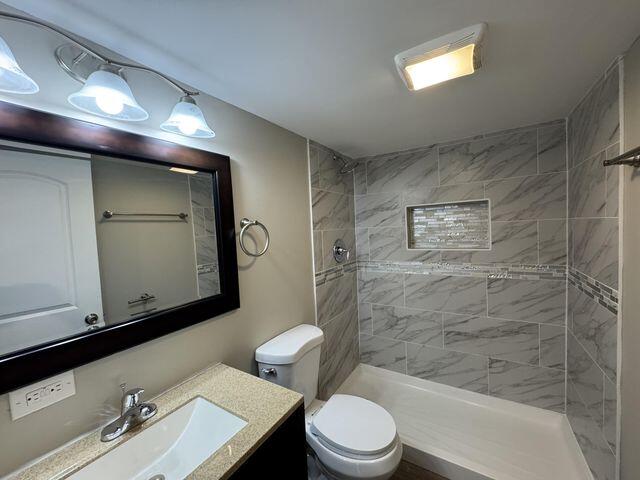 5174 Independence Avenue Portage, IN 46368 - Photo 18 of 26 a bathroom with a sink a toilet and shower