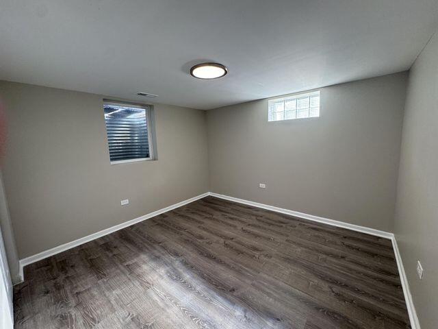 5174 Independence Avenue Portage, IN 46368 - Photo 19 of 26 an empty room with wooden floor and windows