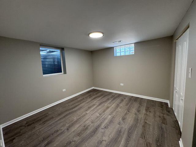 5174 Independence Avenue Portage, IN 46368 - Photo 20 of 26 an empty room with wooden floor and windows