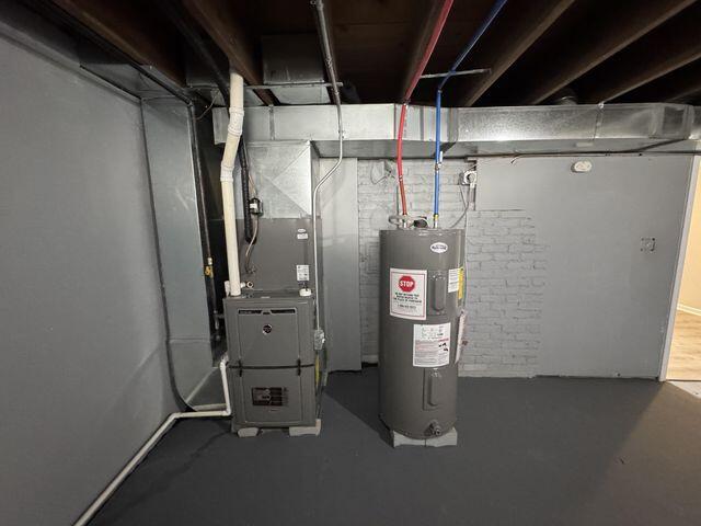5174 Independence Avenue Portage, IN 46368 - Photo 21 of 26 a room with water heater and storage