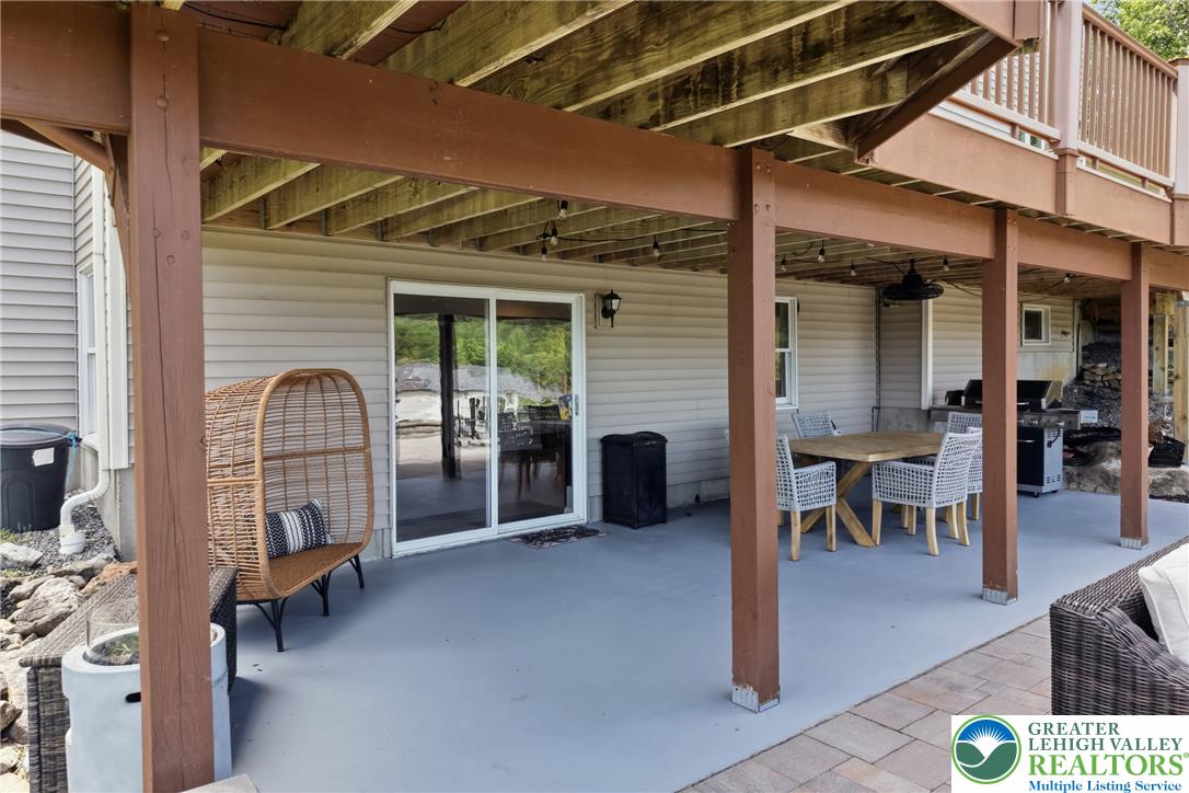 115 West Butternut Road Hellertown, PA 18055 - Photo 79 of 97 An inviting covered patio, ideal for alfresco dining, extends from the home's lower level.