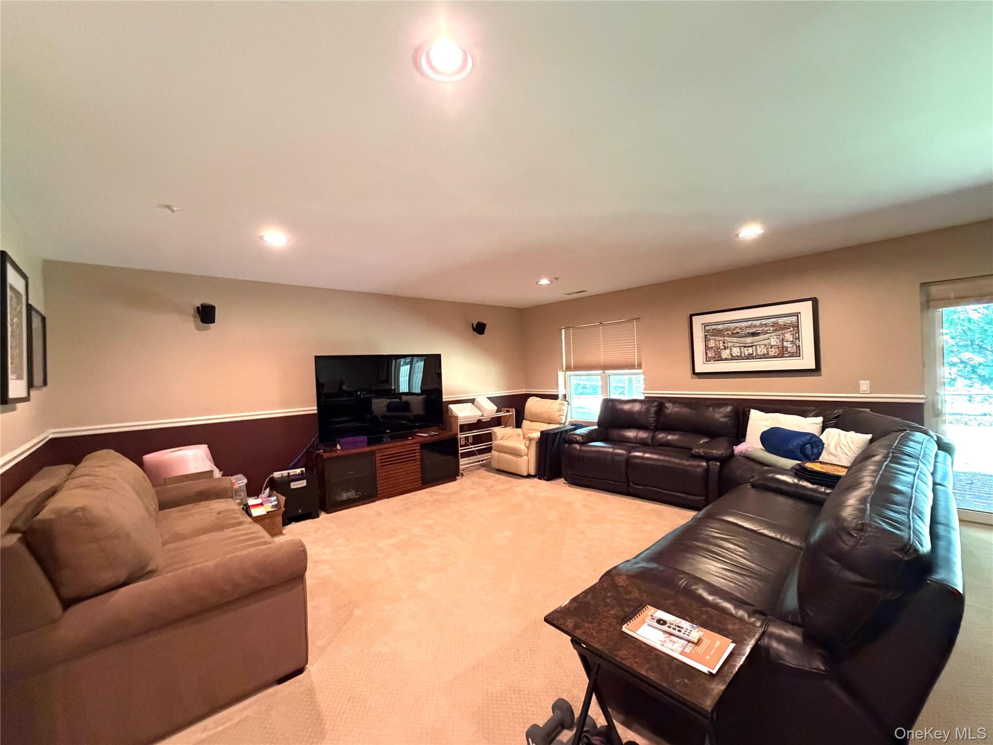 121 Winding Ridge Road White Plains, NY 10603 - Photo 29 of 43 Huge above ground finished basement with sliding glass doors to backyard