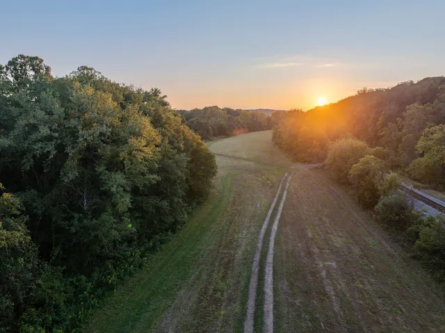 an aerial view of city and lake