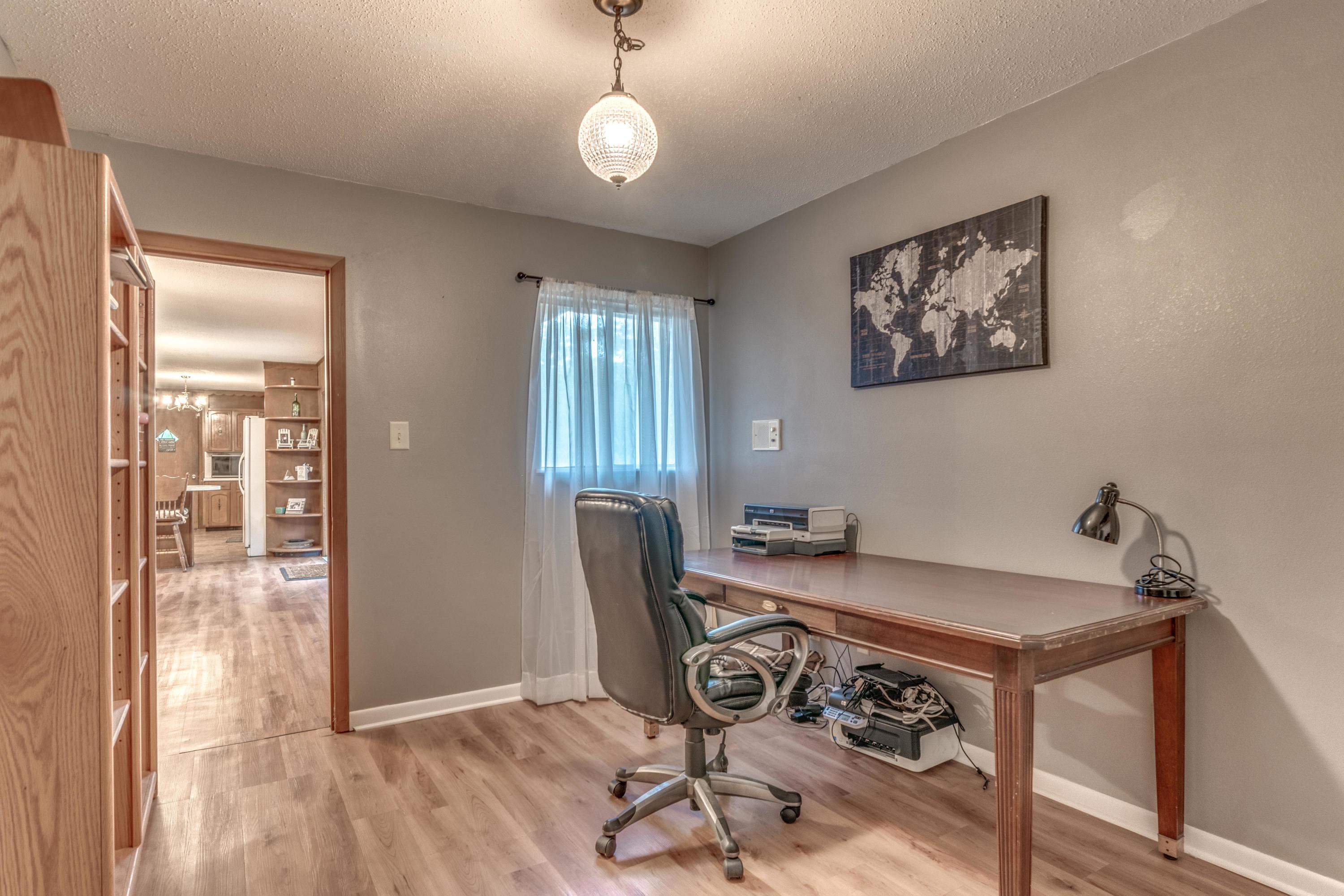 837 Cardinal Street Fort Walton Beach, FL 32547 - Photo 18 of 24 a view of a dining room with furniture and wooden floor