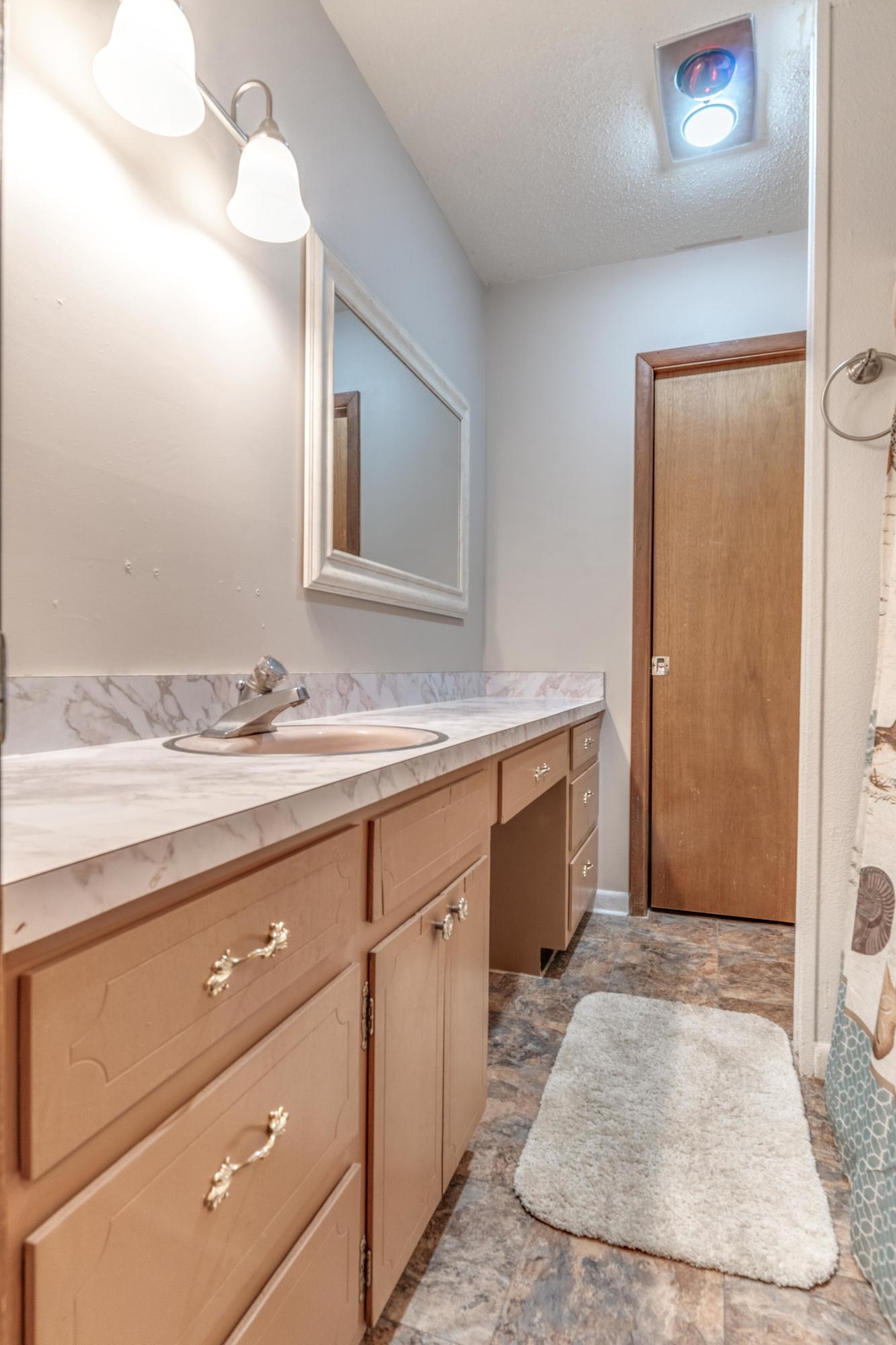 837 Cardinal Street Fort Walton Beach, FL 32547 - Photo 20 of 24 a bathroom with a sink and a mirror