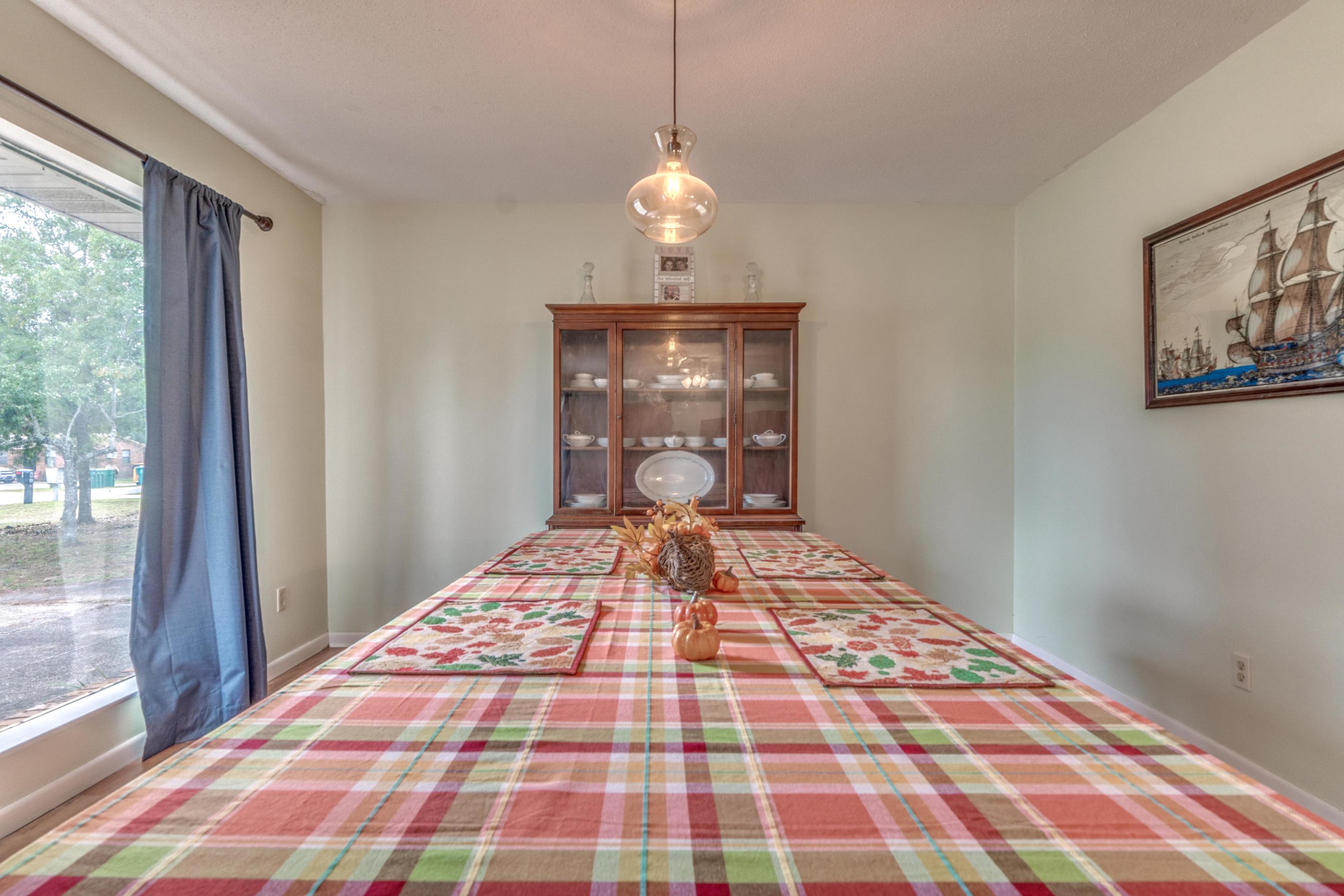 837 Cardinal Street Fort Walton Beach, FL 32547 - Photo 3 of 24 a bedroom with a bed and wooden floor