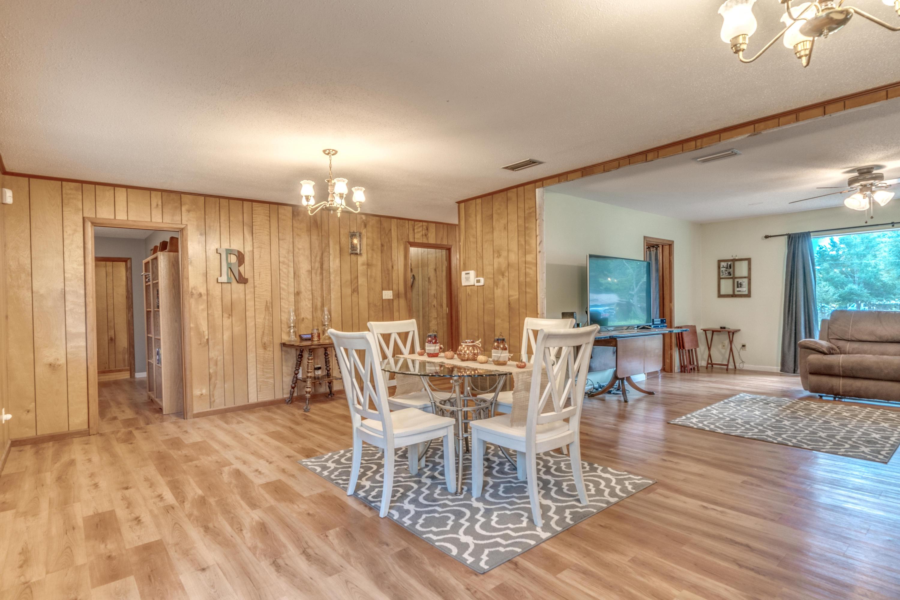 837 Cardinal Street Fort Walton Beach, FL 32547 - Photo 7 of 24 a view of a a dining room with furniture window and wooden floor