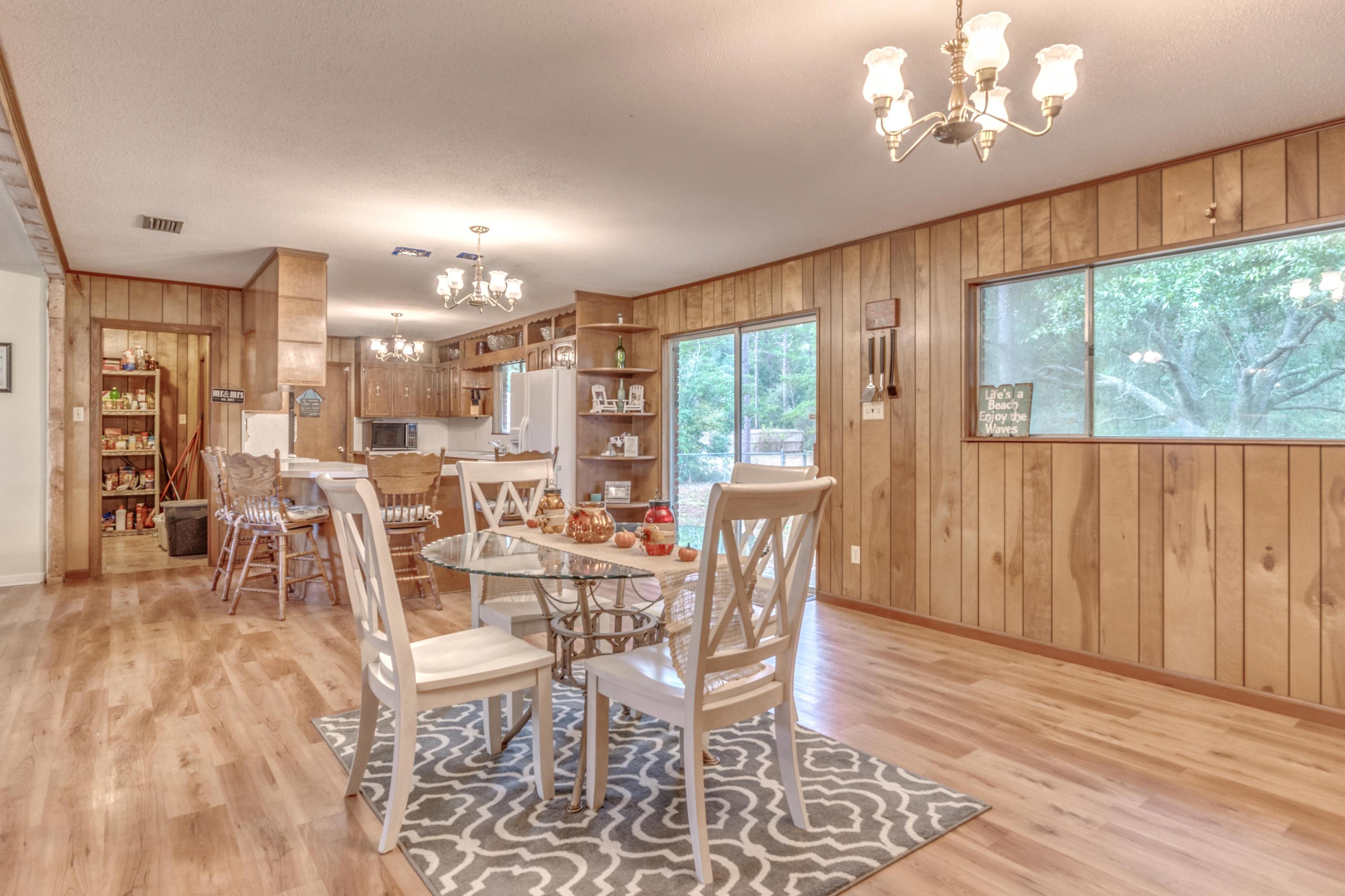 837 Cardinal Street Fort Walton Beach, FL 32547 - Photo 8 of 24 a view of a dining room with furniture window and outside view