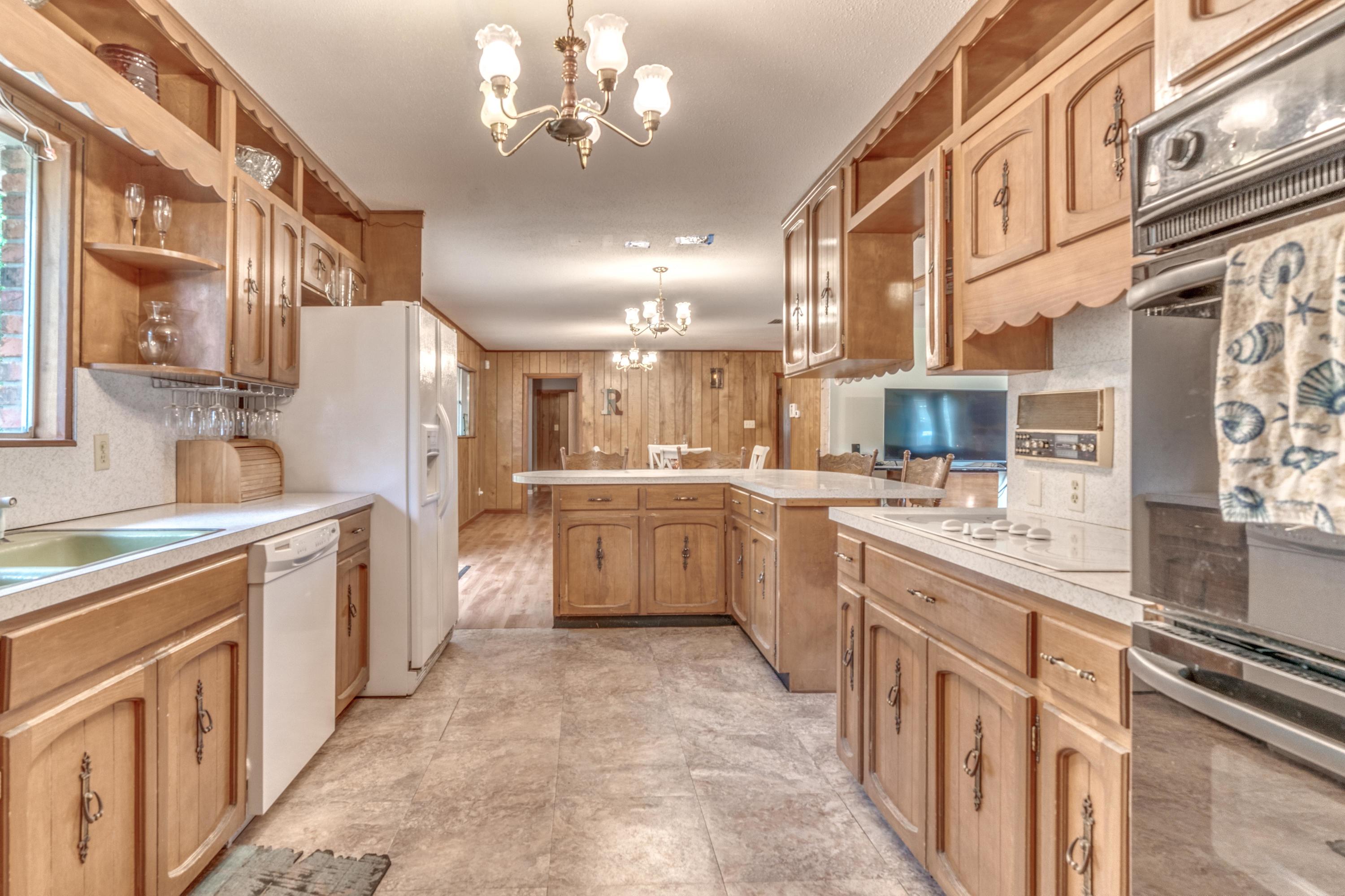 837 Cardinal Street Fort Walton Beach, FL 32547 - Photo 10 of 24 a large kitchen with stainless steel appliances lots of counter space and a sink