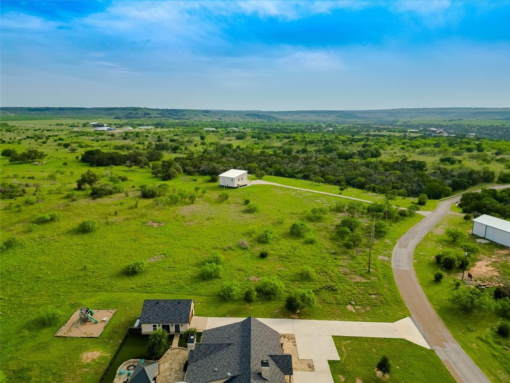 4-6 Hells Gate Loop Strawn, TX 76475 - Photo 5 of 13 an aerial view of a houses with a yard