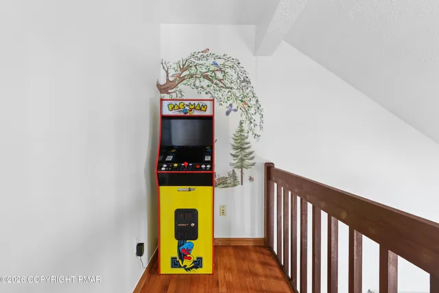 a view of living room with furniture and a fireplace