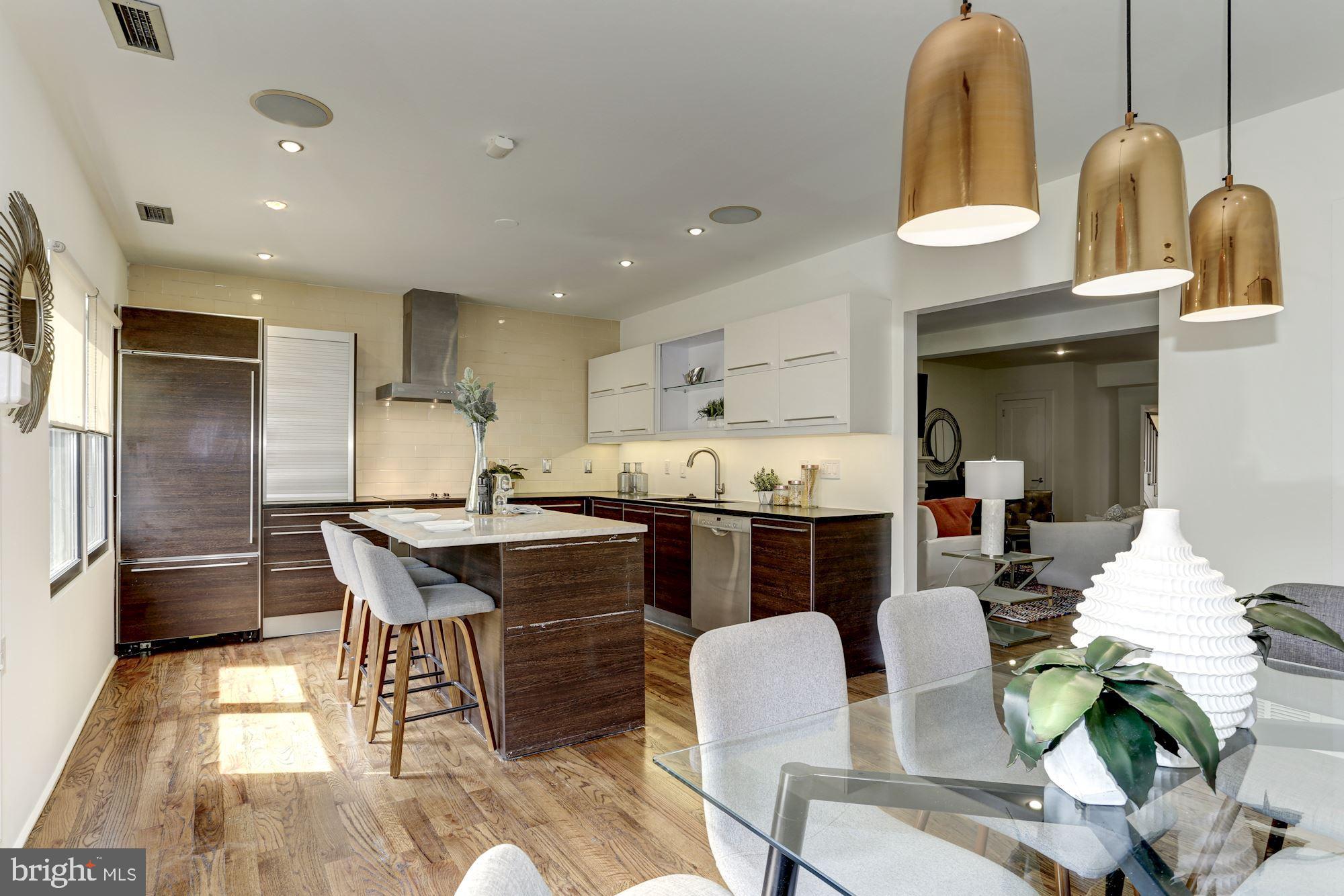420 Ridge Street Northwest Washington, DC 20001 - Photo 12 of 56 From Dining Space into Island Kitchen