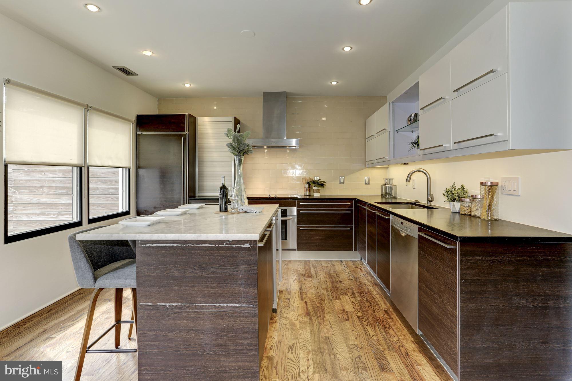 420 Ridge Street Northwest Washington, DC 20001 - Photo 14 of 56 Superior finishes incl Sub Zero fridge+custom cab.
