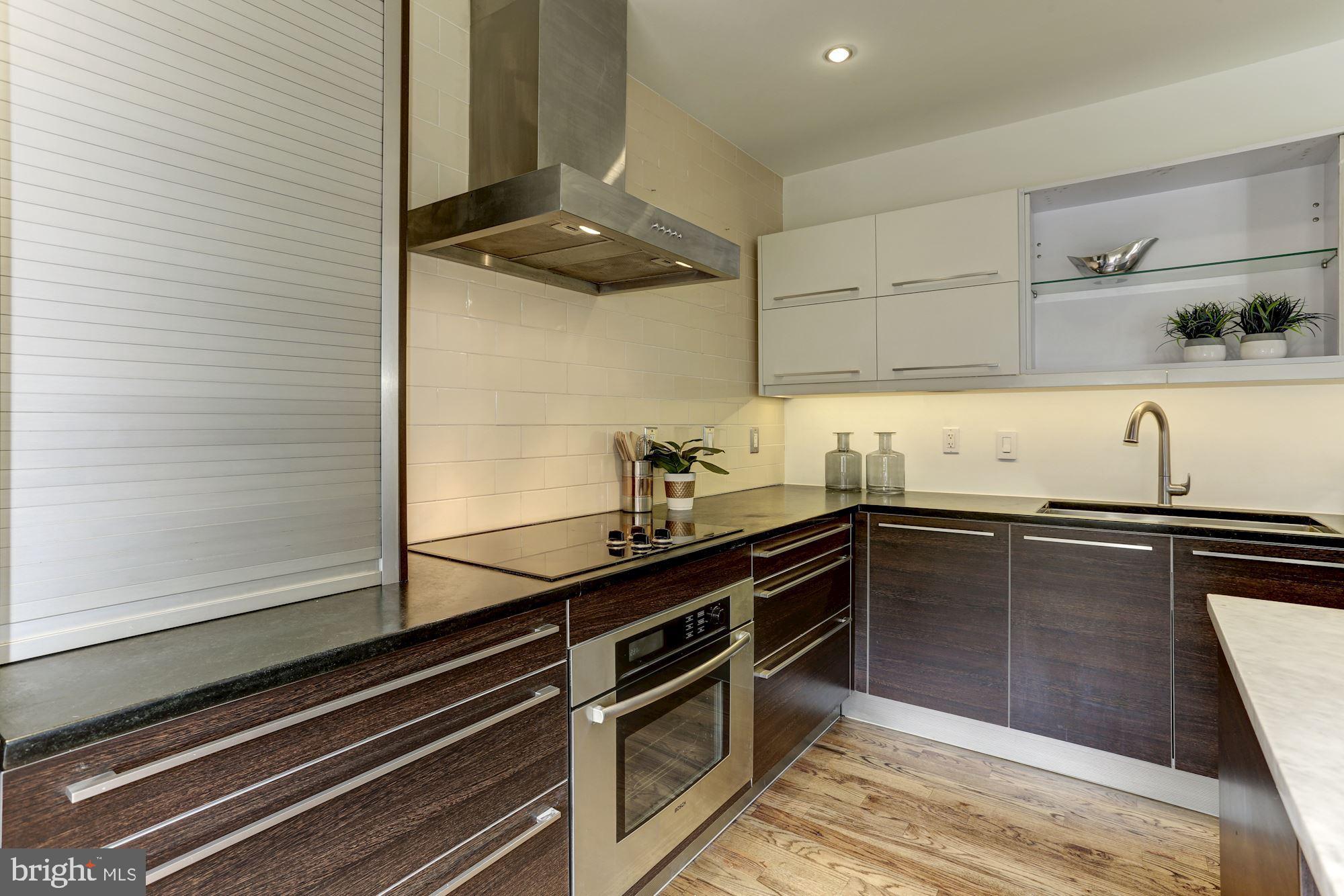 420 Ridge Street Northwest Washington, DC 20001 - Photo 16 of 56 Zephyr hood and plentiful granite counter space.