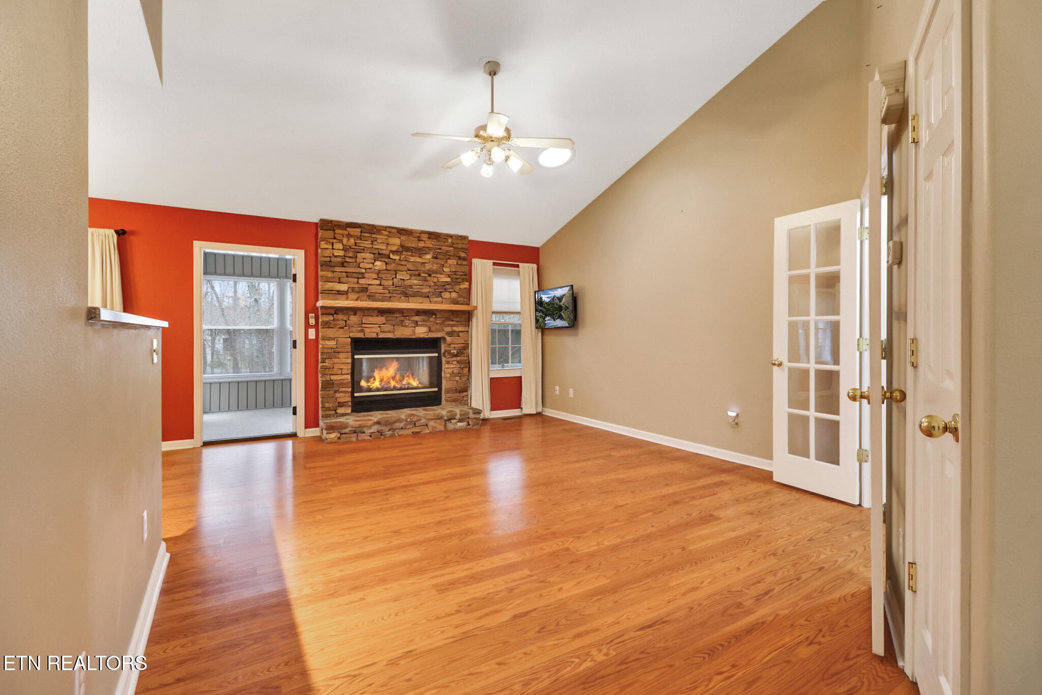 121 St George Drive Crossville, TN 38558 - Photo 13 of 37 a view of an empty room with wooden floor fireplace and a window