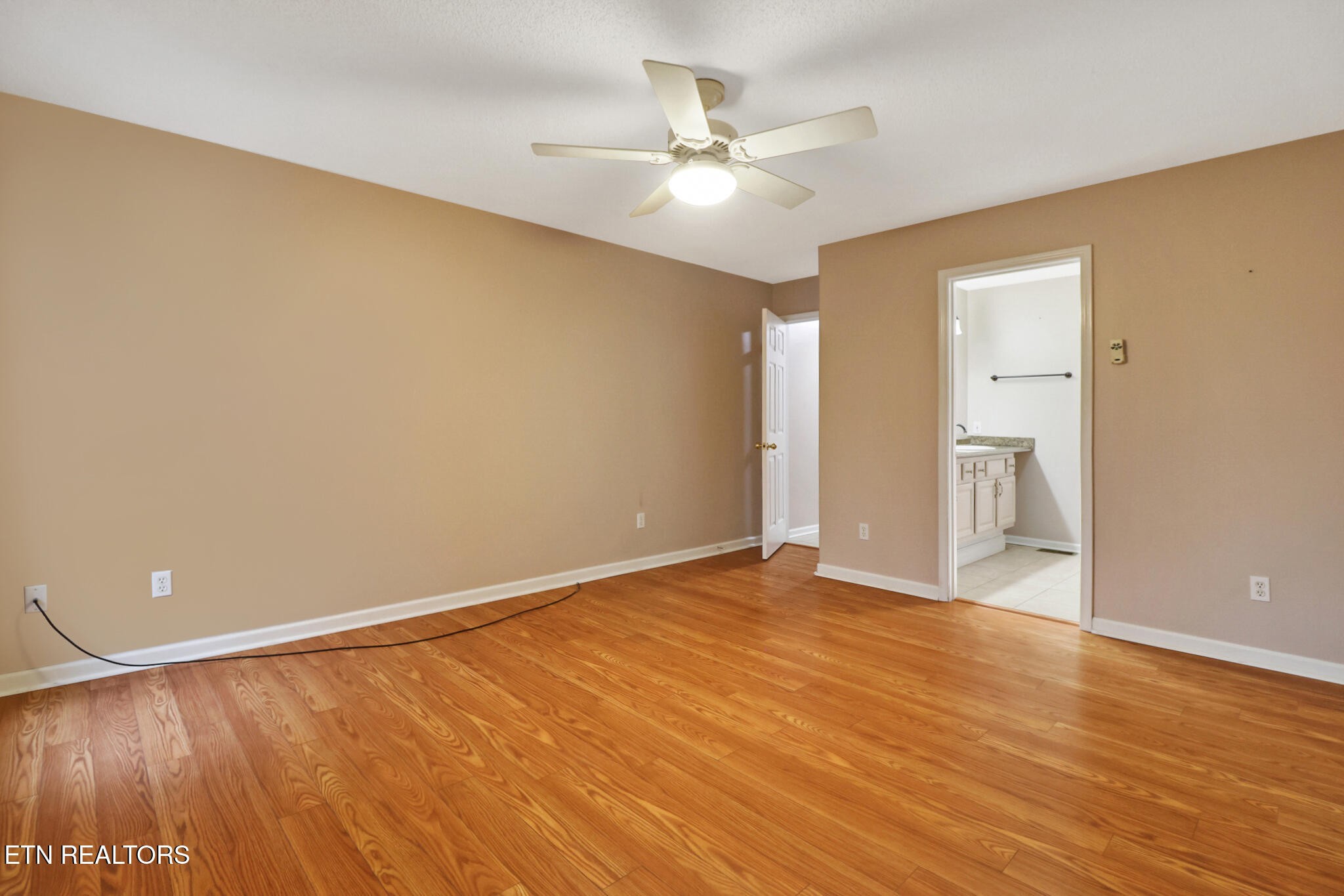 121 St George Drive Crossville, TN 38558 - Photo 23 of 37 a view of an empty room with wooden floor