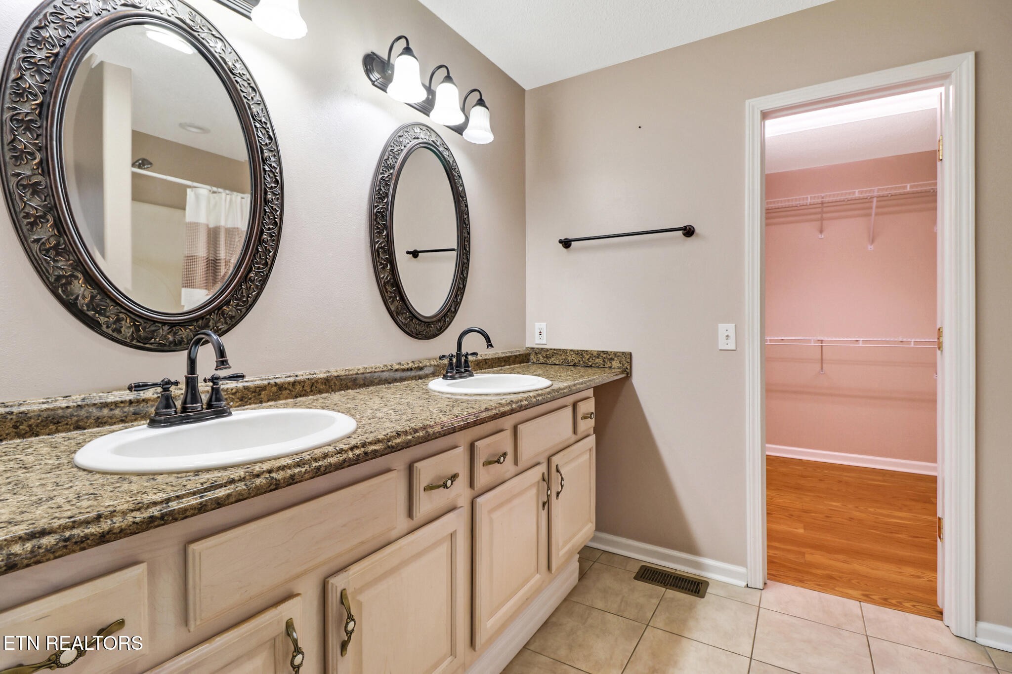 121 St George Drive Crossville, TN 38558 - Photo 24 of 37 a bathroom with a granite countertop sink and a mirror