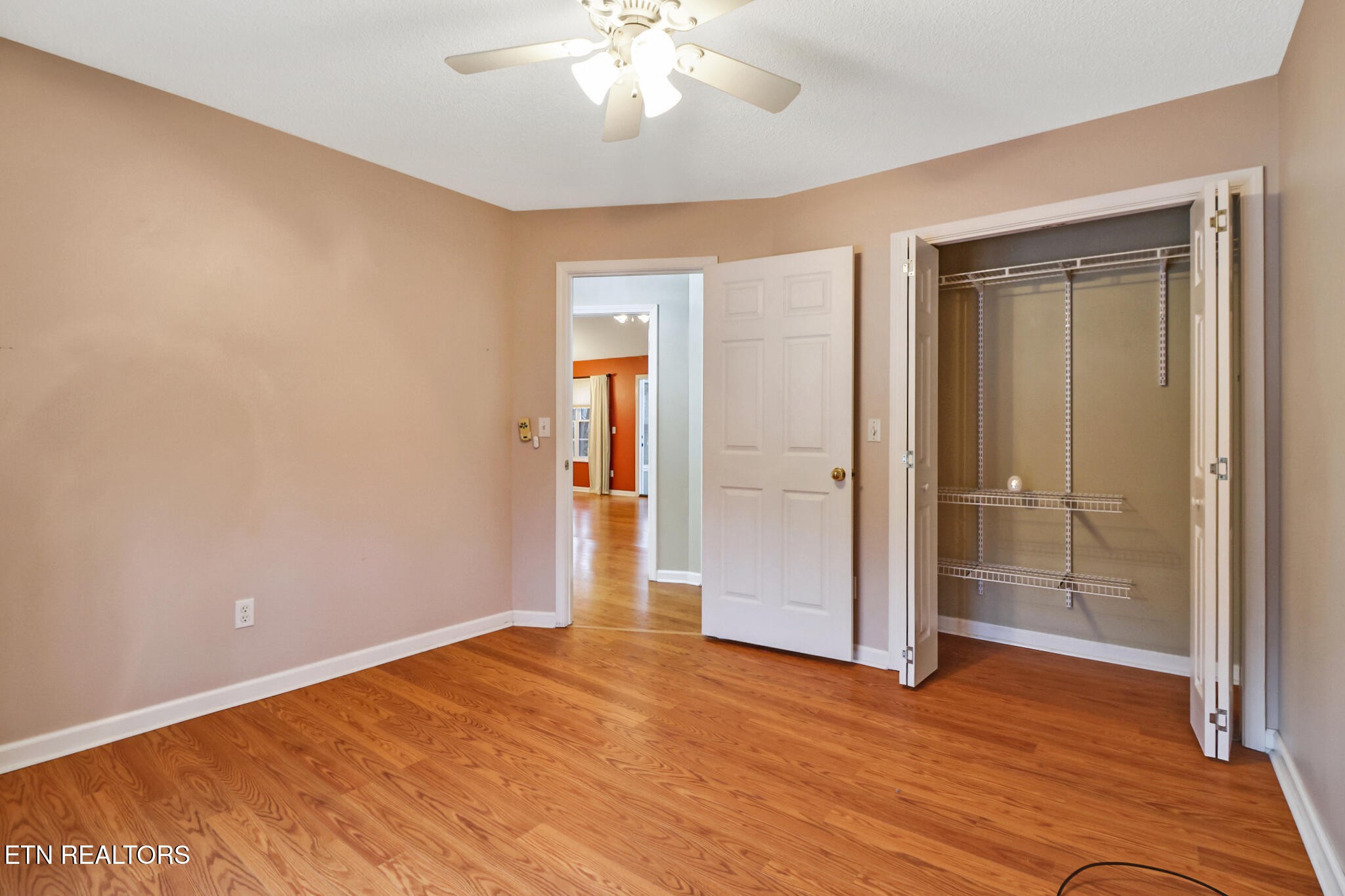 121 St George Drive Crossville, TN 38558 - Photo 28 of 37 wooden floor in an empty room with a window