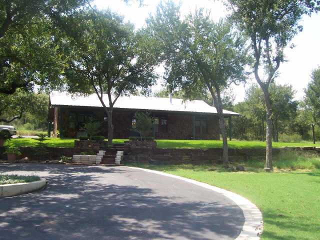 1650 Timber Ridge Road Marble Falls, TX 78654 - Photo 1 of 1 a view of a park with large trees