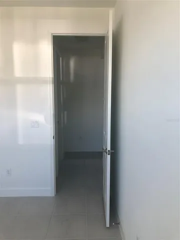 a bathroom with a granite countertop toilet a sink and a bathtub