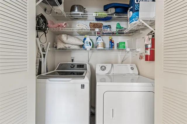 a utility room with dryer and washer