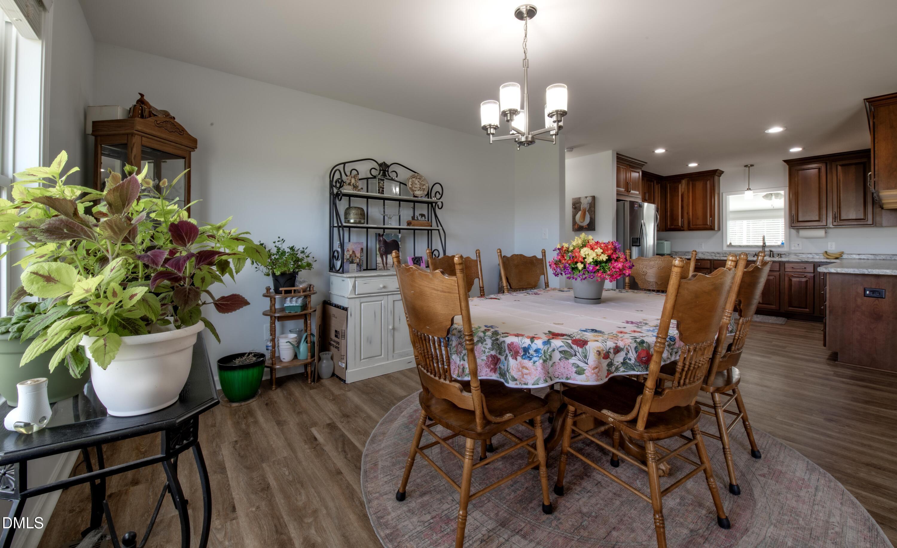 130 Hardy Road Wendell, NC 27591 - Photo 11 of 34 a view of a dining room with furniture and chandelier