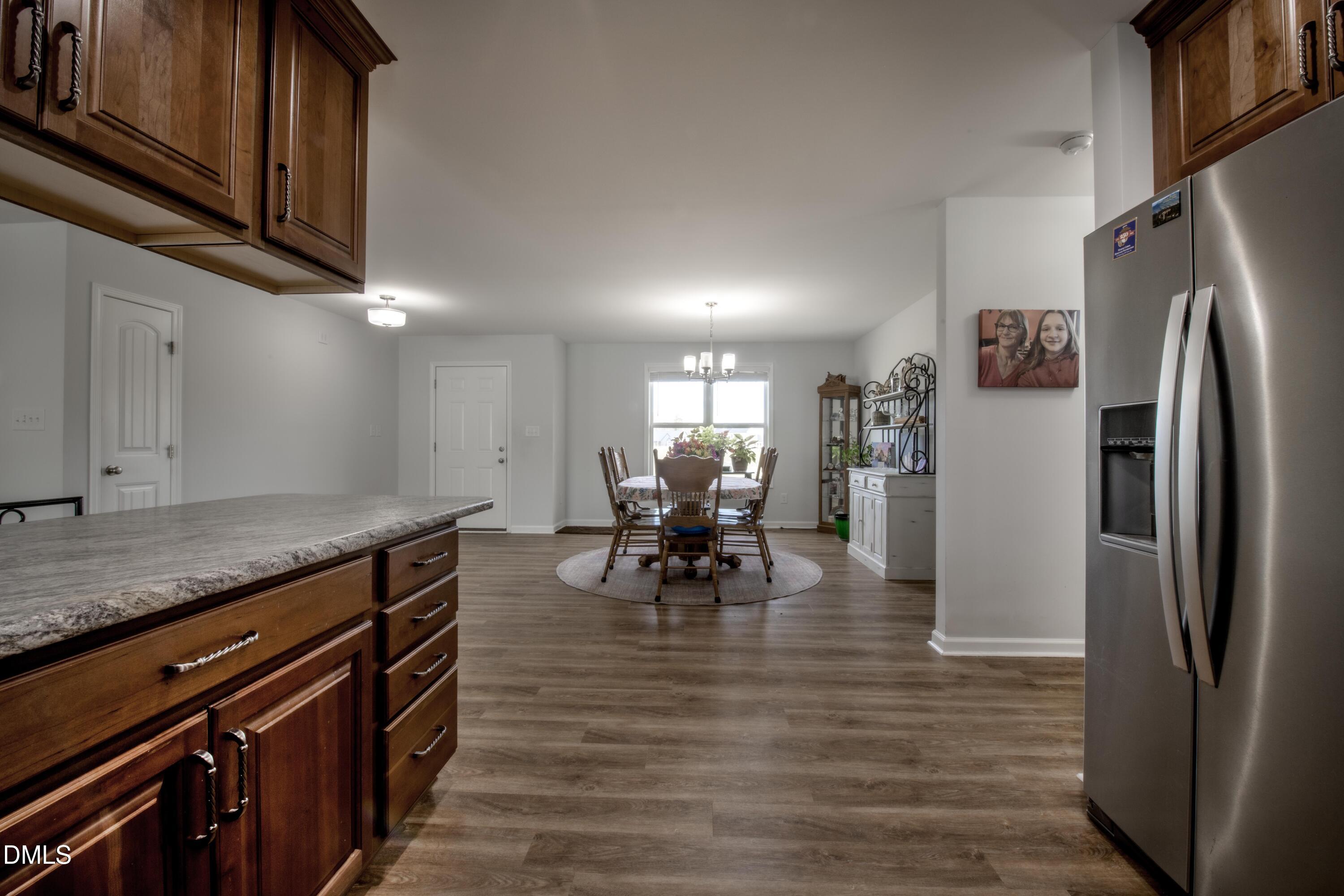 130 Hardy Road Wendell, NC 27591 - Photo 13 of 34 a kitchen with stainless steel appliances granite countertop a refrigerator and a stove top oven