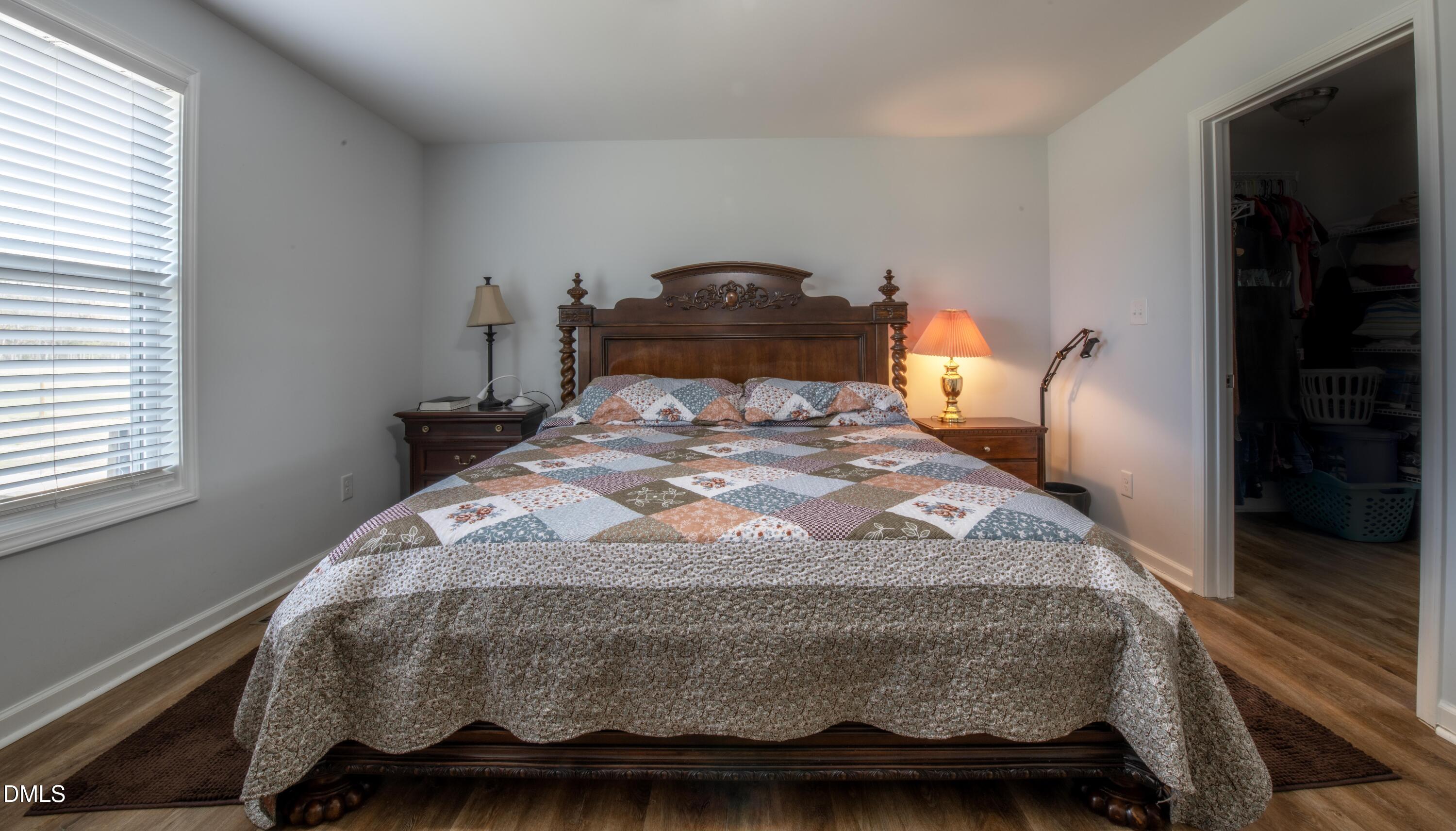 130 Hardy Road Wendell, NC 27591 - Photo 16 of 34 a bedroom with a bed and a window