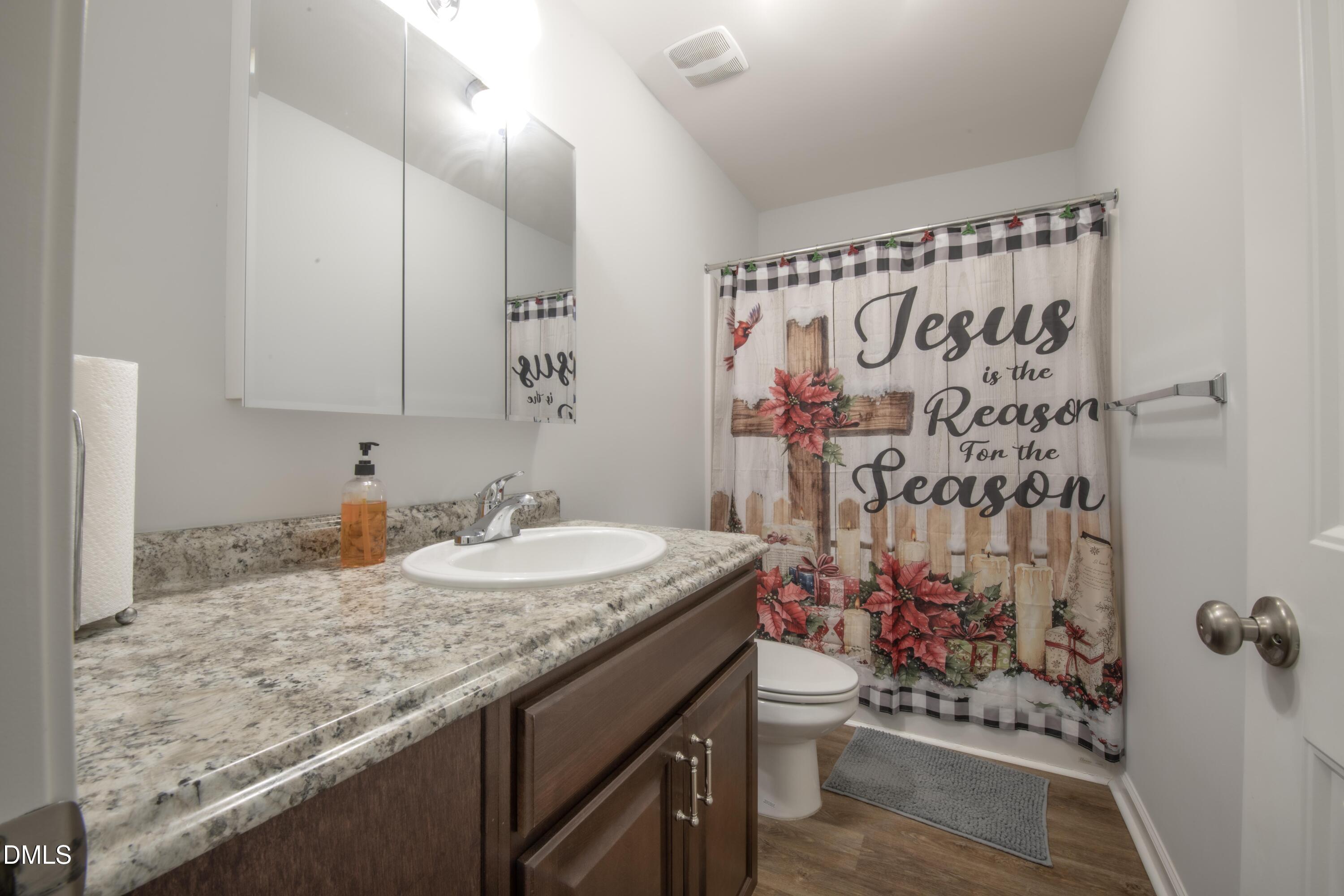 130 Hardy Road Wendell, NC 27591 - Photo 22 of 34 a bathroom with a granite countertop sink and a mirror