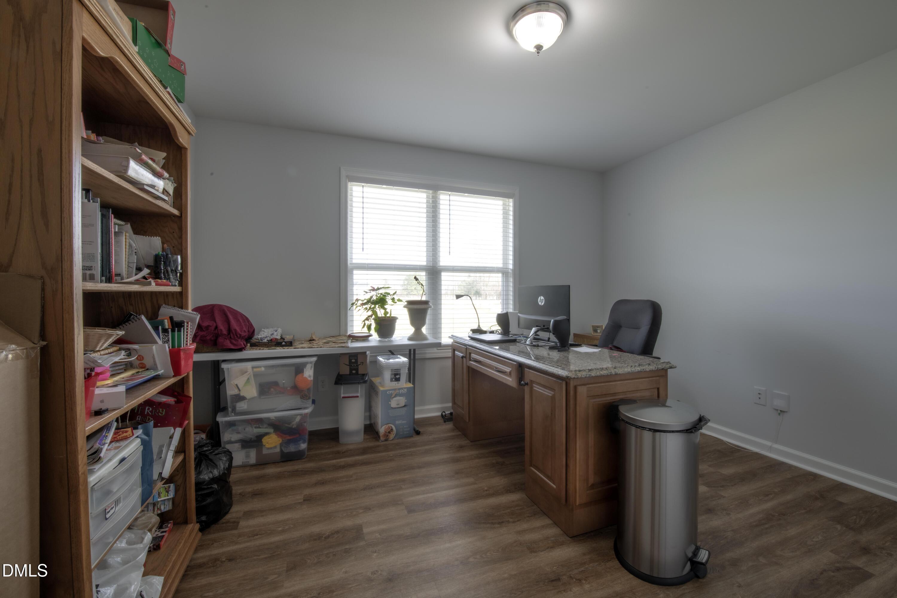 130 Hardy Road Wendell, NC 27591 - Photo 25 of 34 a view of a workspace with furniture and a window