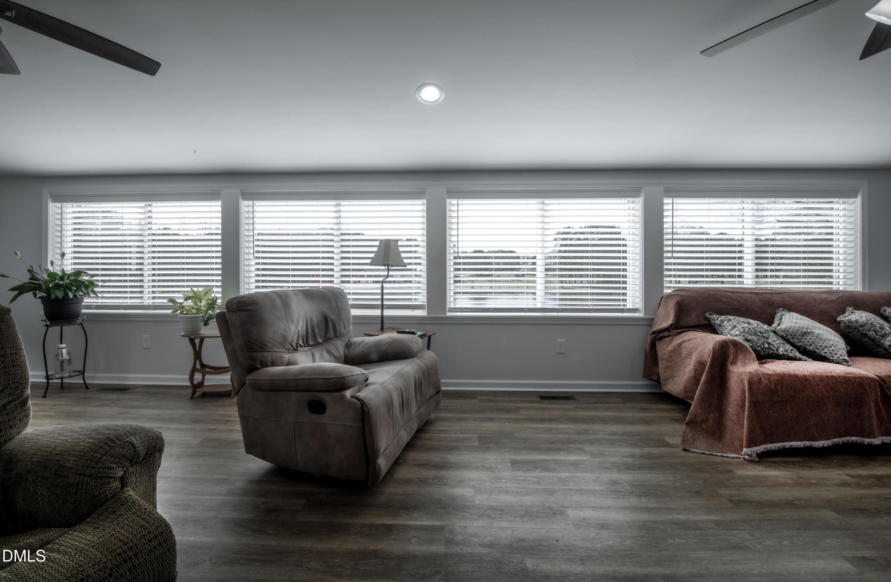 130 Hardy Road Wendell, NC 27591 - Photo 27 of 34 a living room with furniture and a large window