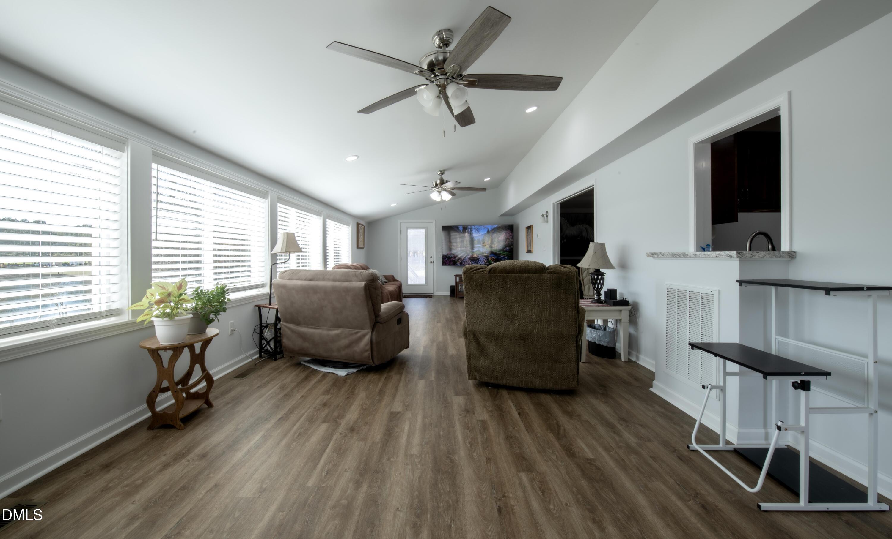 130 Hardy Road Wendell, NC 27591 - Photo 28 of 34 a living room with furniture and a flat screen tv