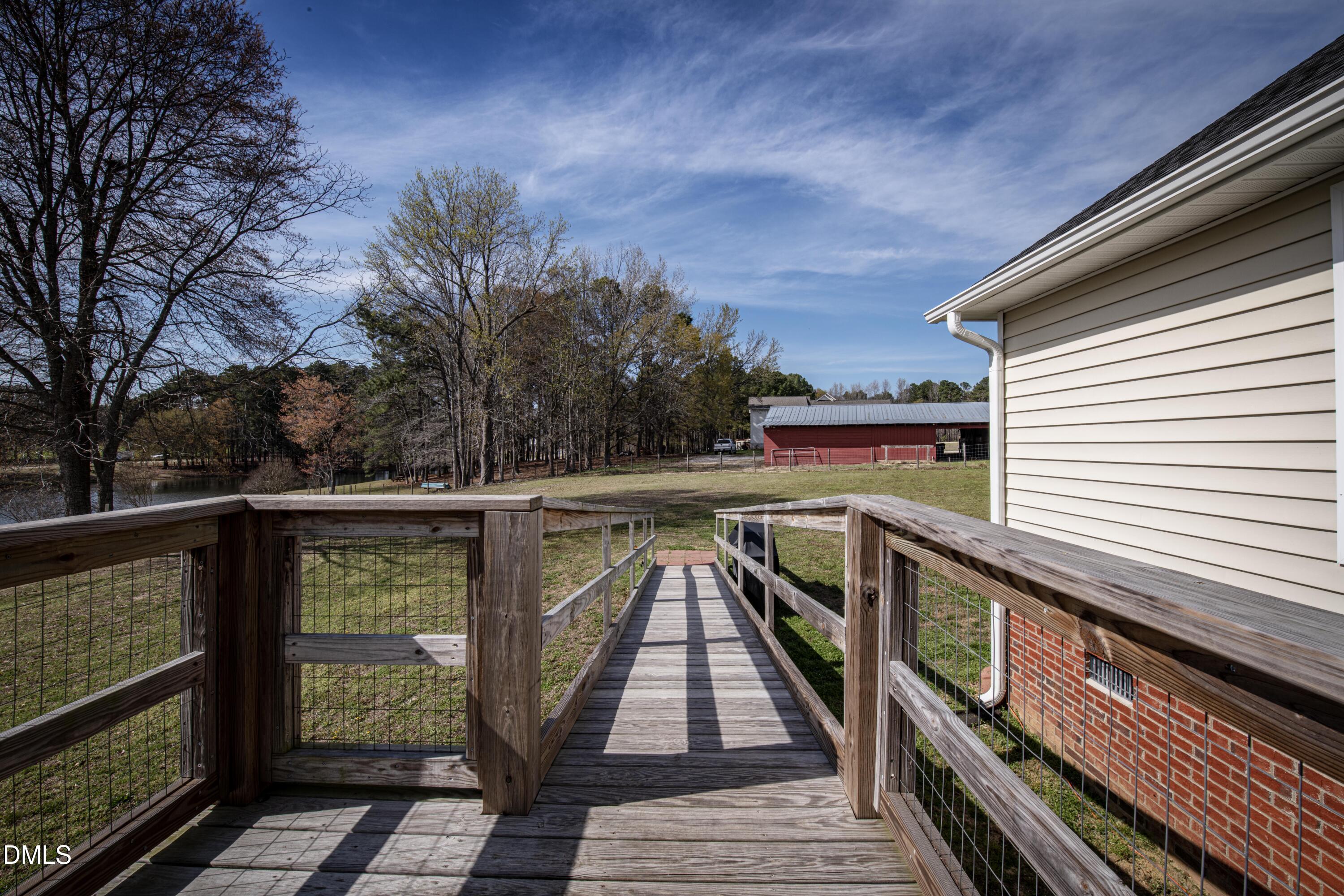 130 Hardy Road Wendell, NC 27591 - Photo 30 of 34 a view of balcony with wooden floor and fence